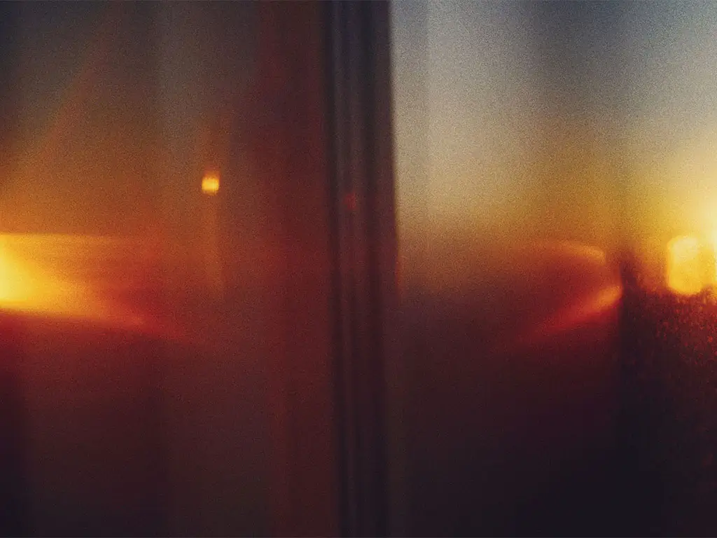 Sunset reflected in an office window symbolizing strategic reflection and business decision-making